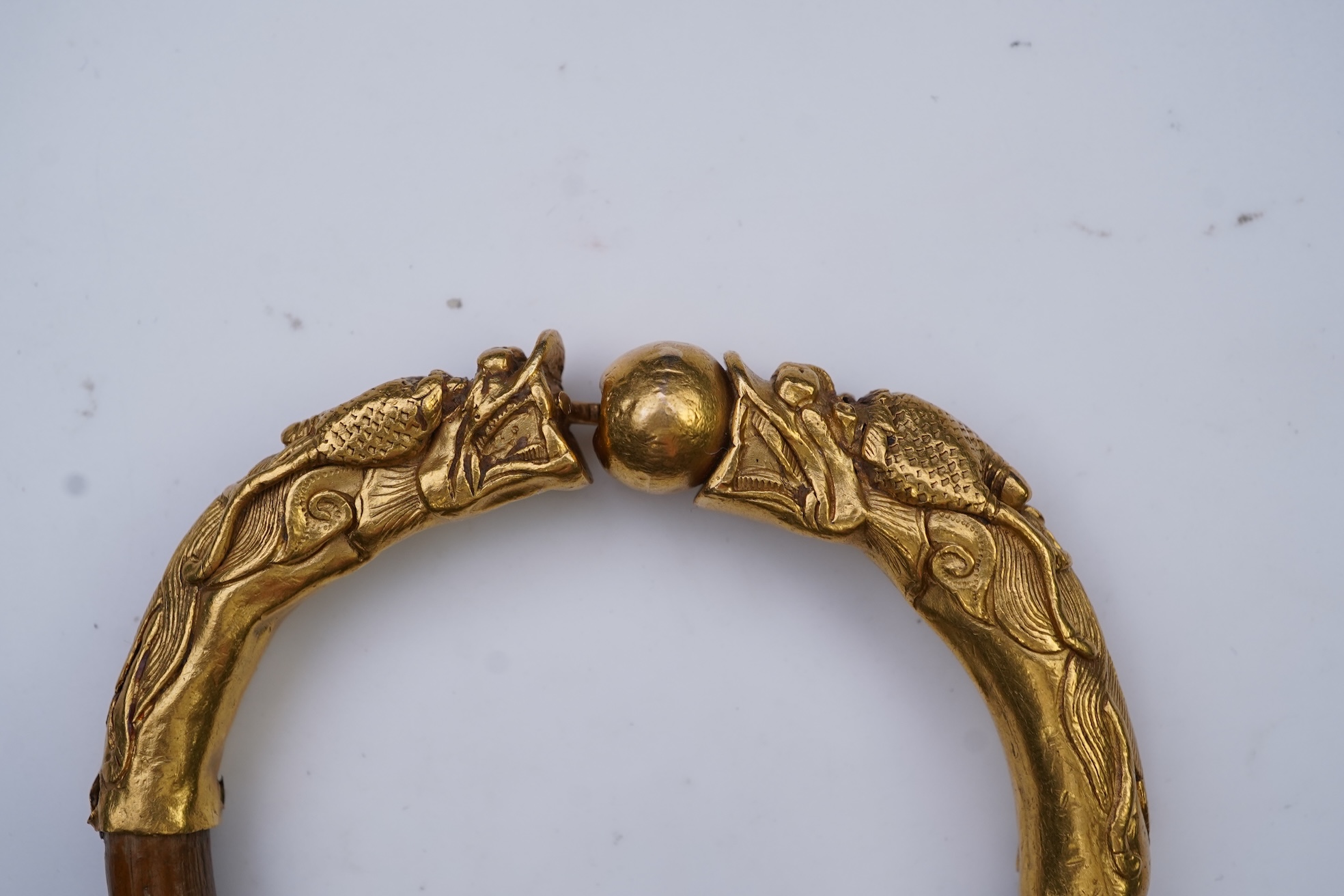 A gold and wood bangle, China, late 19th/early 20th century